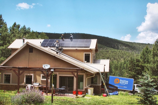 Positive Energy Solar installing solar panels on a house